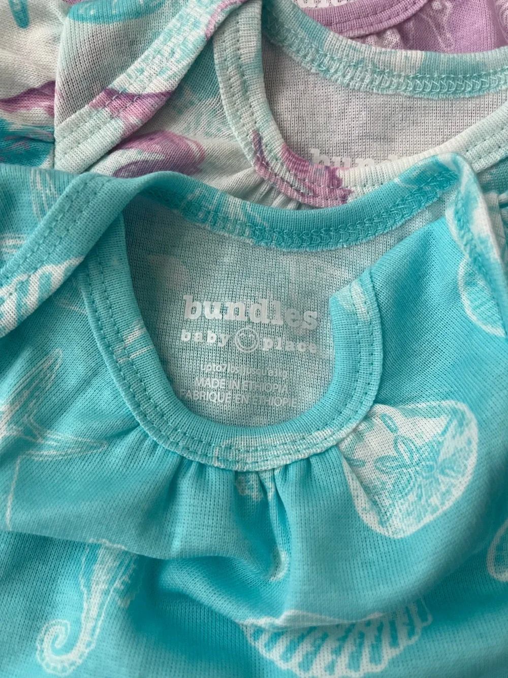 The Children’s Place Newborn 5 Bodysuits & 3 Shorts Set in Pastel Seashell Print